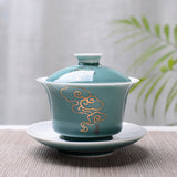 Celadon gaiwan with an elegant gold cloud mist design